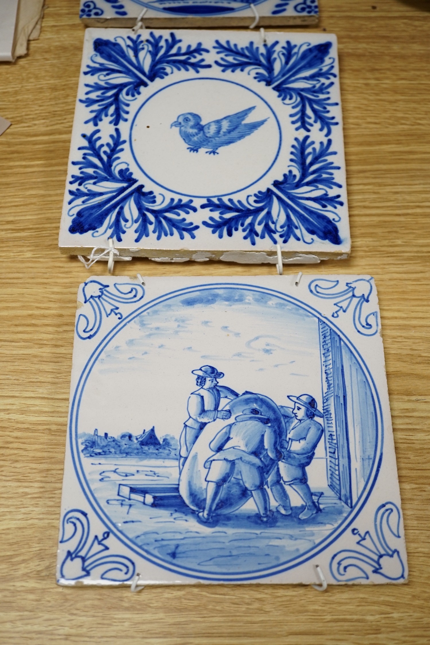 A collection of Delft and other blue and white tiles, 18th century and later (4)